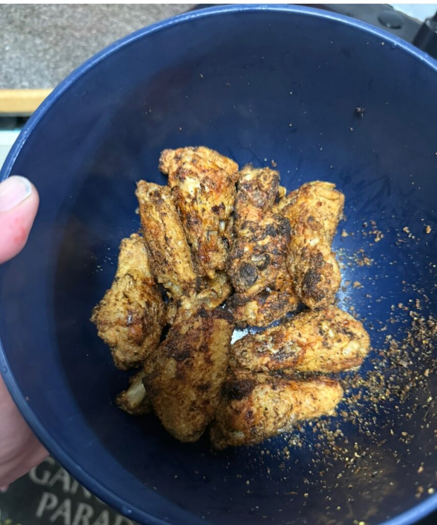 Lemon pepper wings in a blue bowl