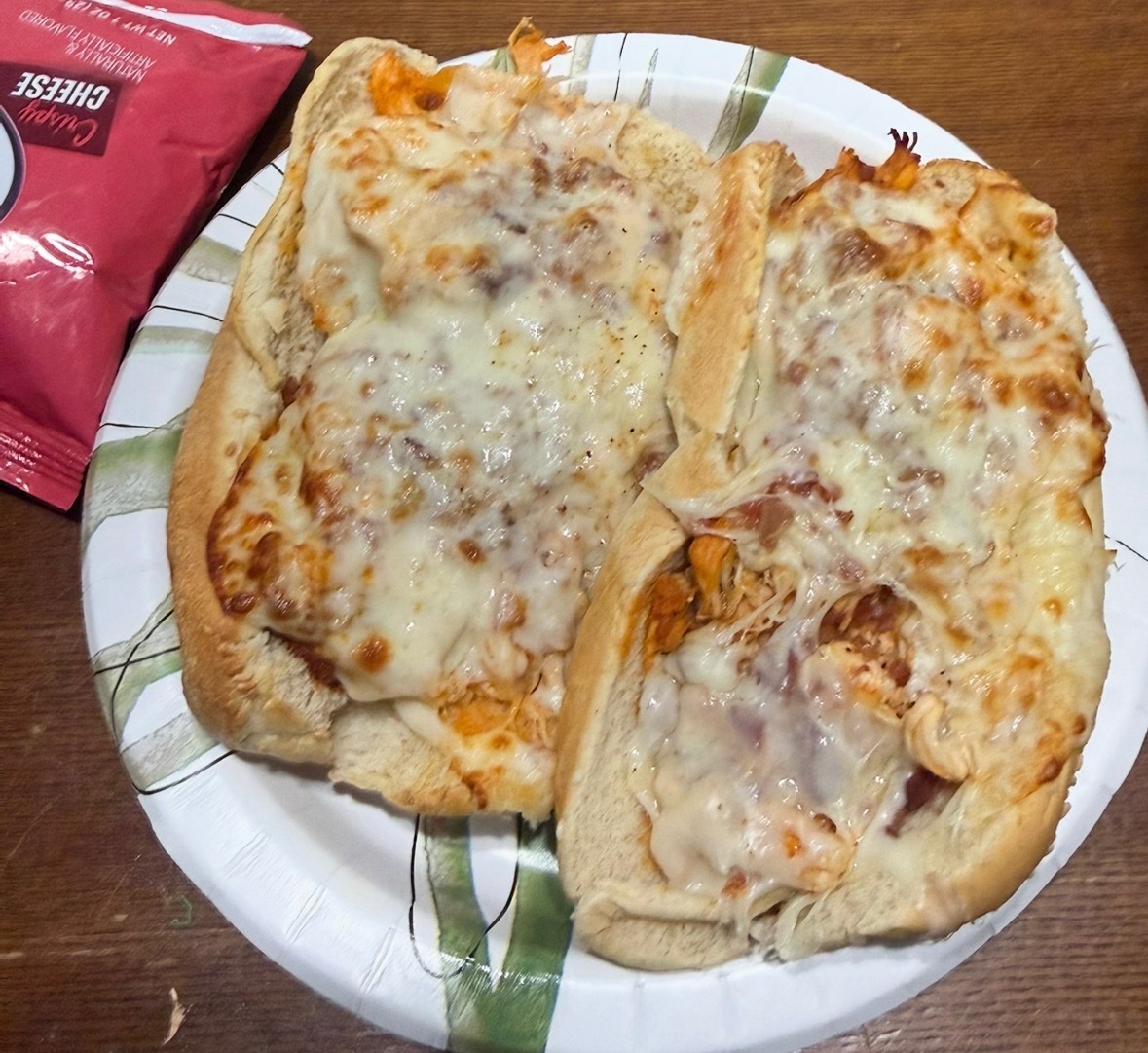 Two finished buffalo chicken hoagies