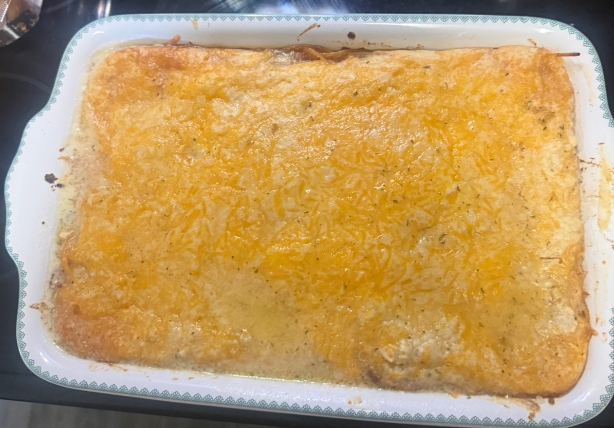 Cheddar Bay Spaghetti Casserole in a white 9x13 baking dish
