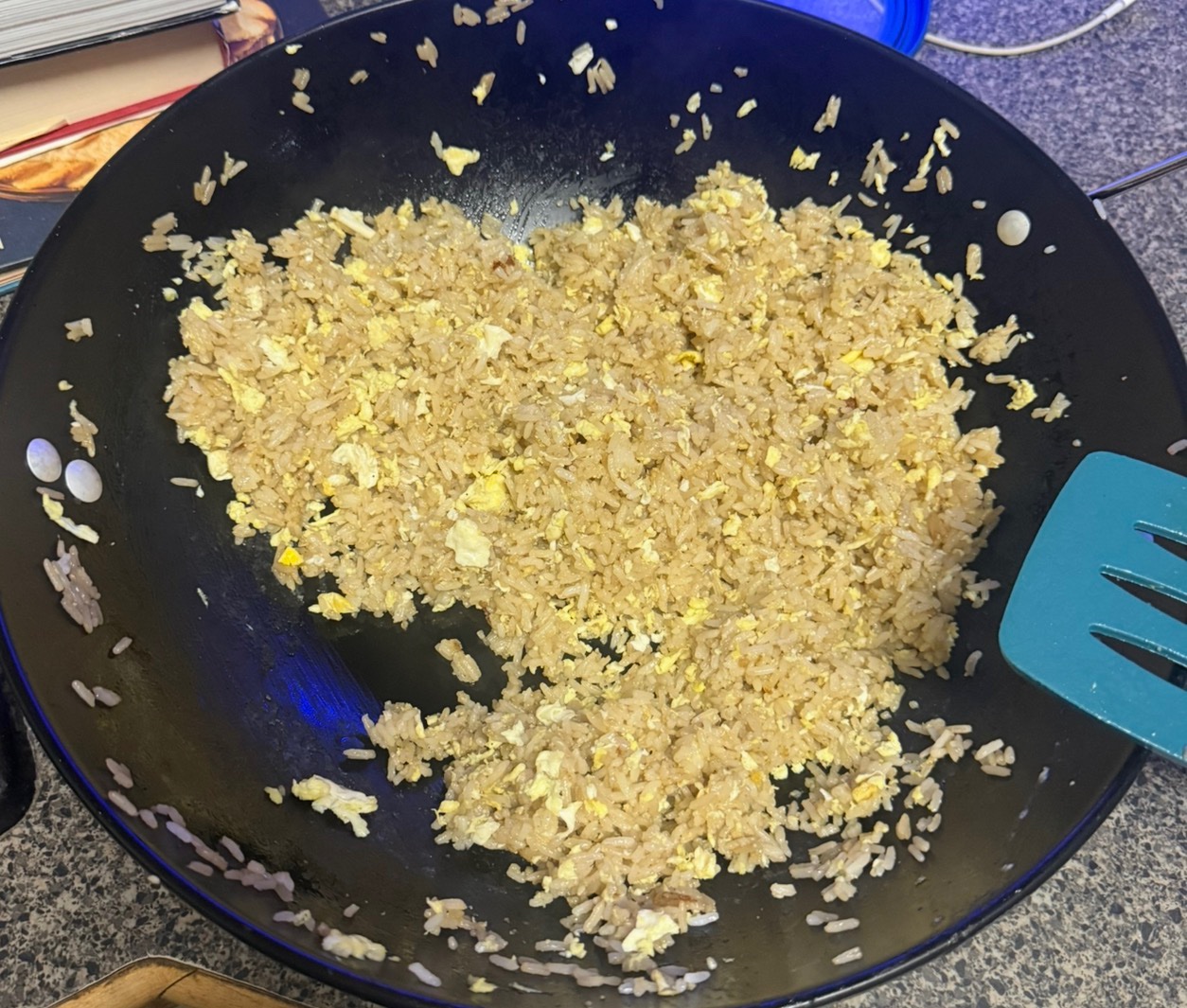 Egg fried rice in a black wok
